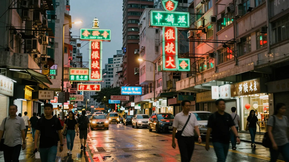 Dense Hong Kong Mong Kok street at dusk with layered neon signs