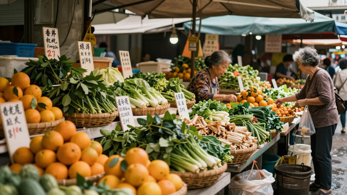 Dense Hong Kong wet market stall with produce piles and handwritten price cards