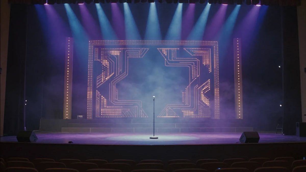 Vintage 1990s Hong Kong concert stage empty and glowing under blue and violet spotlights with an ornate LED backdrop