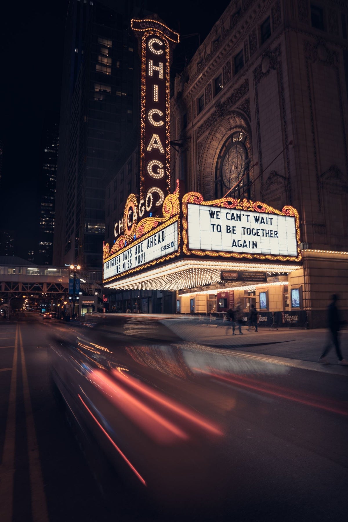 A classic lit cinema marquee at night with vintage theatre lettering