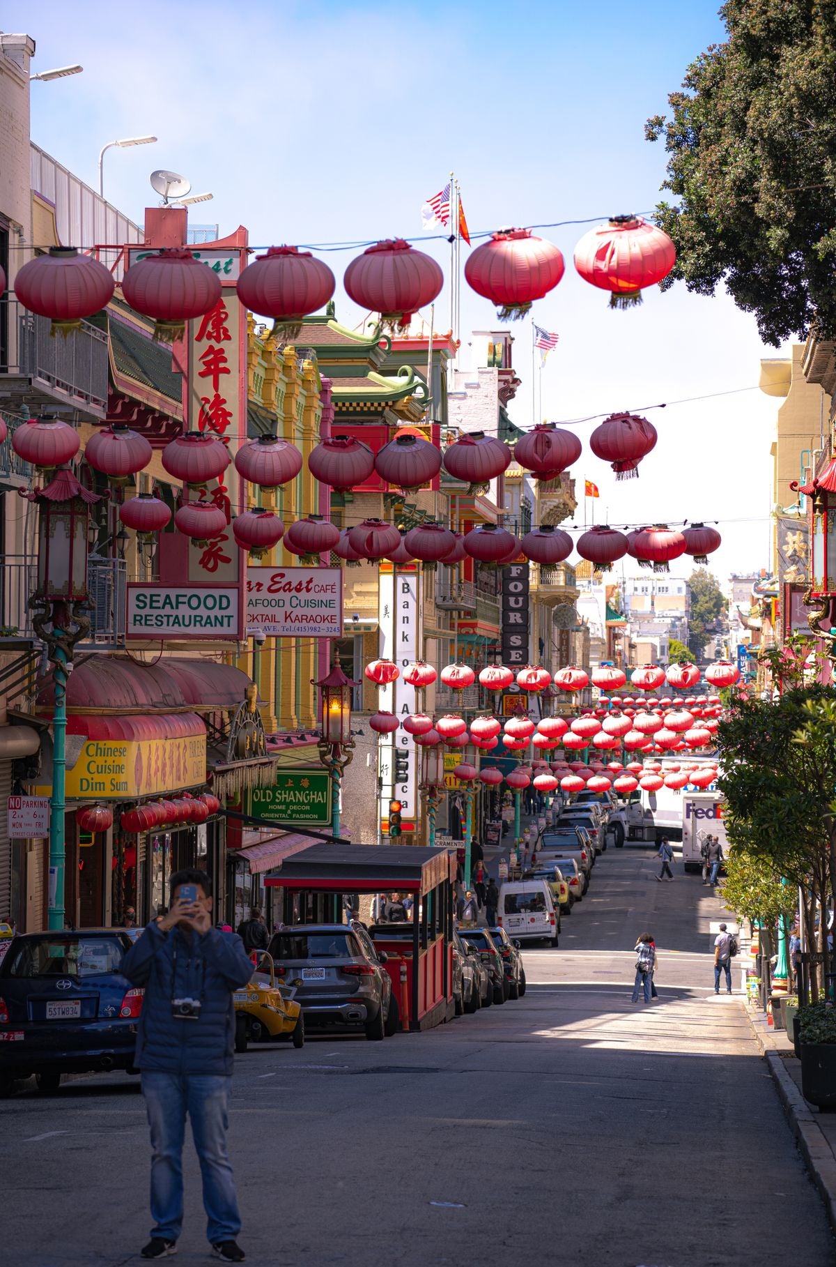 Chinese red lanterns hanging over a Chinatown street