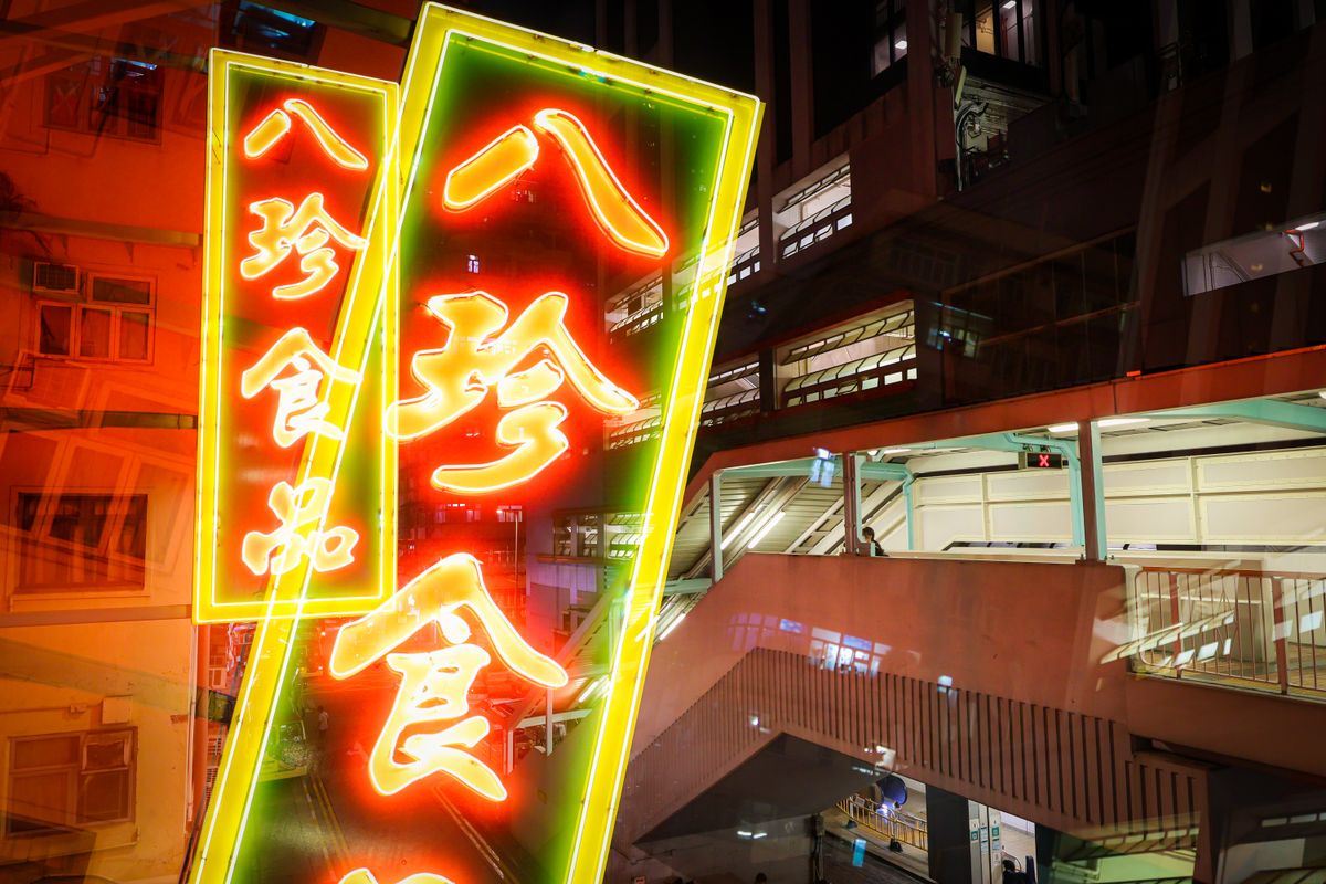 Neon-lit street in Mong Kok, Hong Kong at night