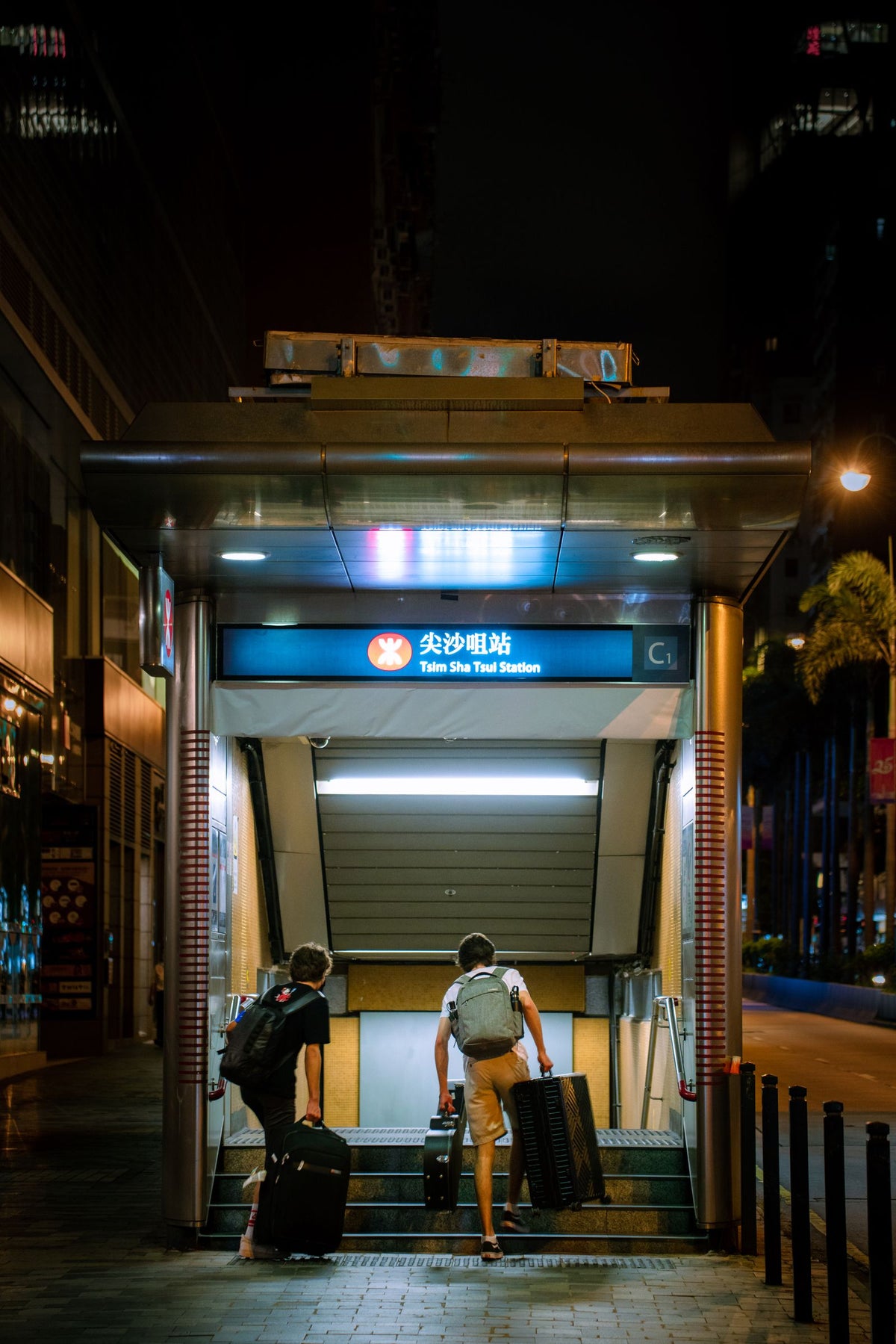 Commuters entering Tsim Sha Tsui MTR station in Hong Kong