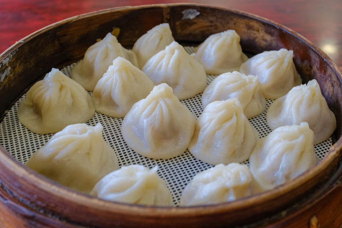 Traditional dumplings on a bamboo steamer