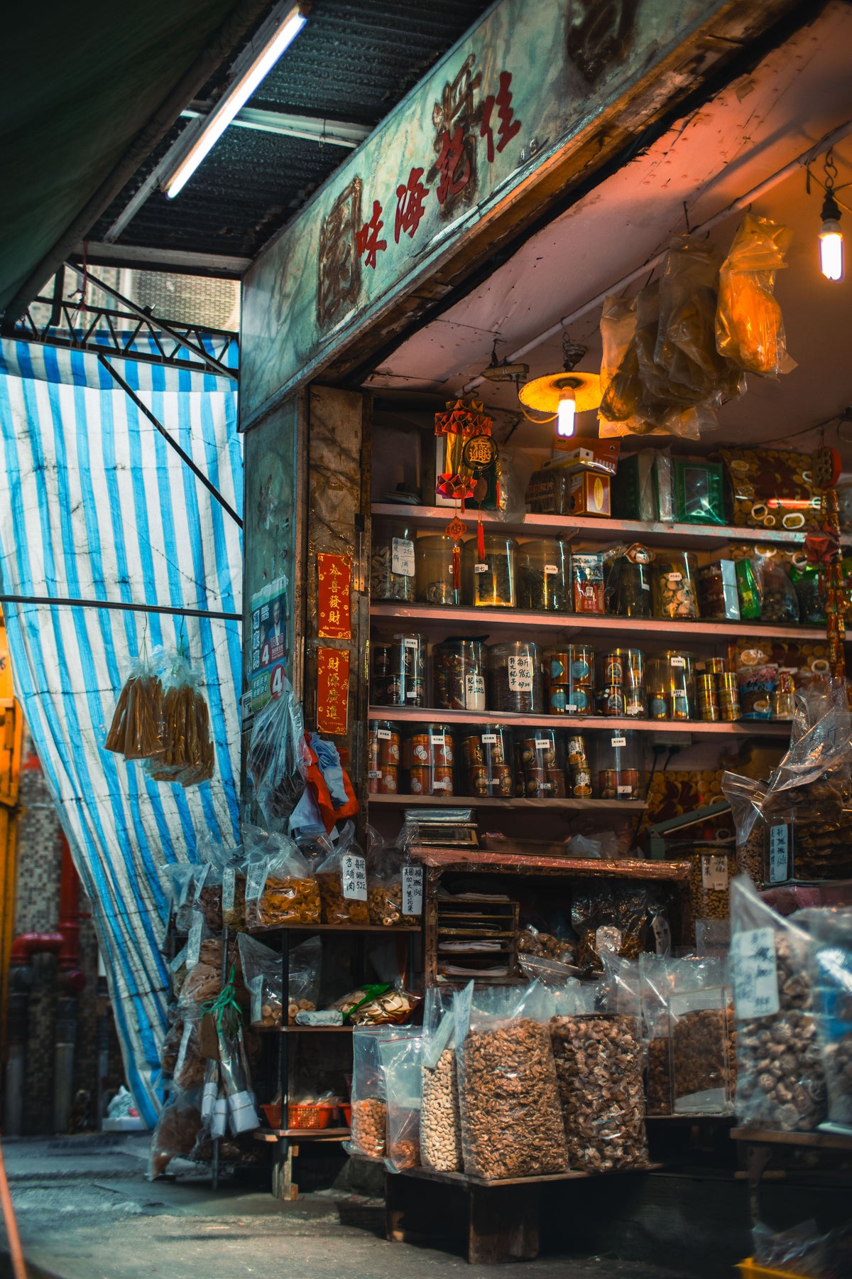 Colorful Hong Kong street market stall with produce and groceries on display