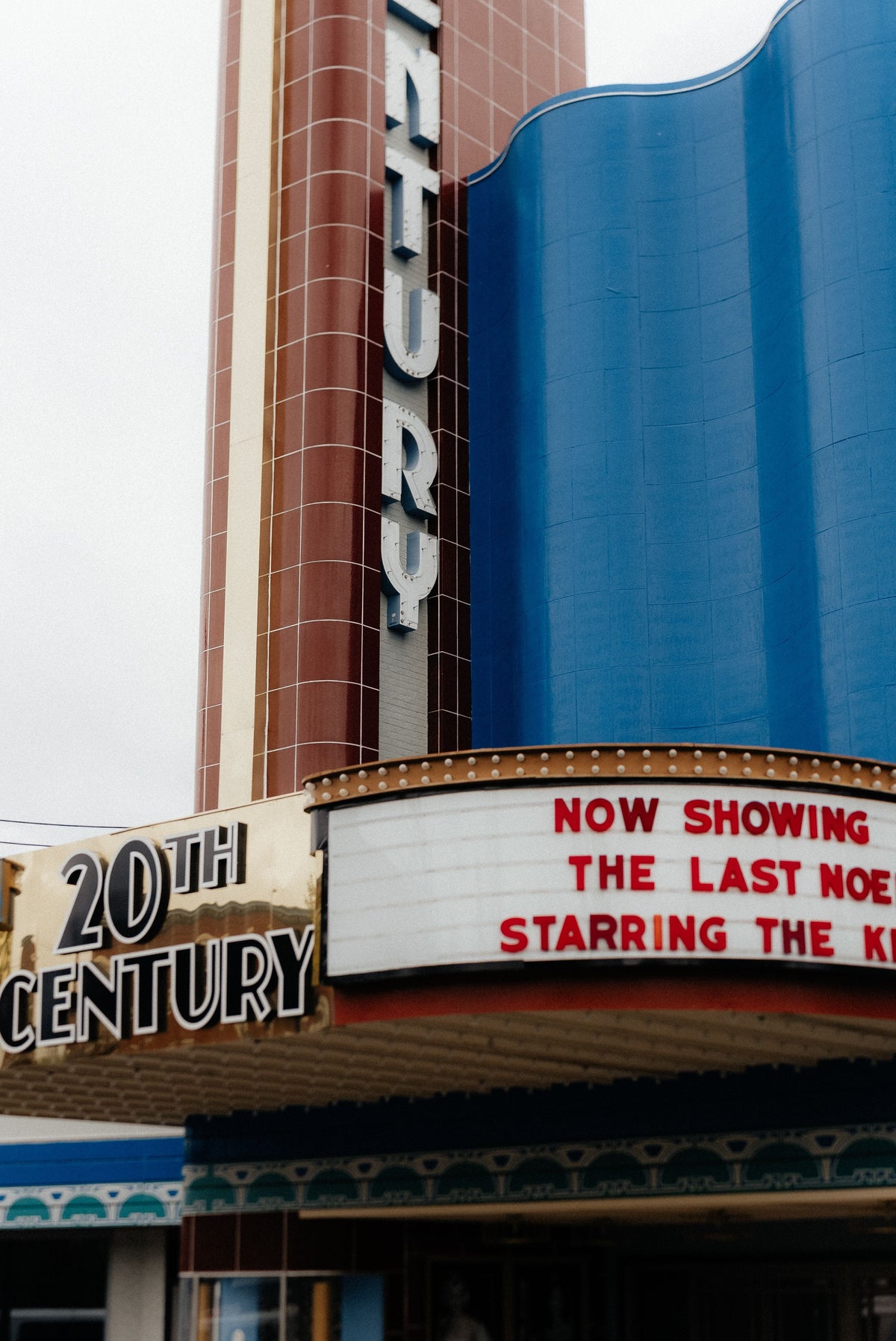 Art Deco cinema facade with a vintage marquee sign