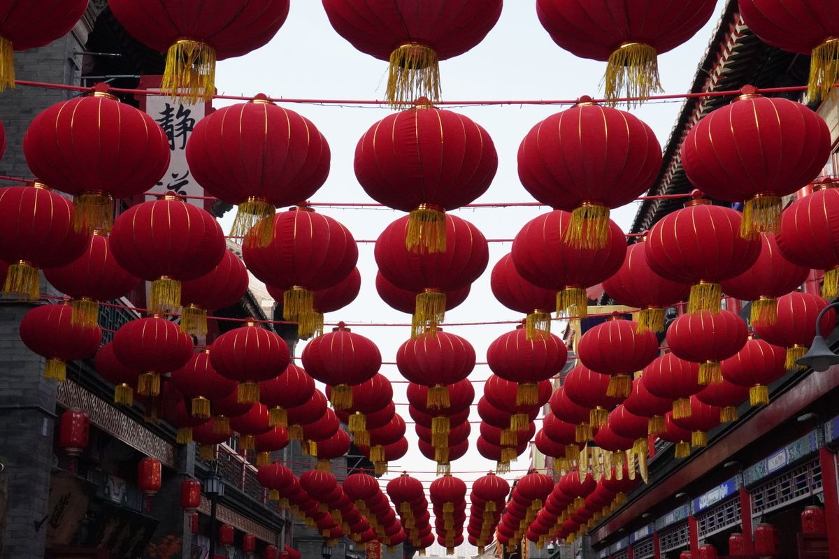 Red Chinese lanterns hanging overhead, evoking the festival atmosphere of Cheung Chau