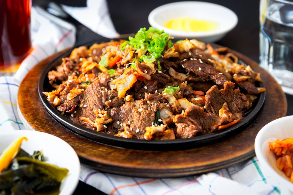 Cooked meat on a plate — evoking the crackling glow of siu yuk