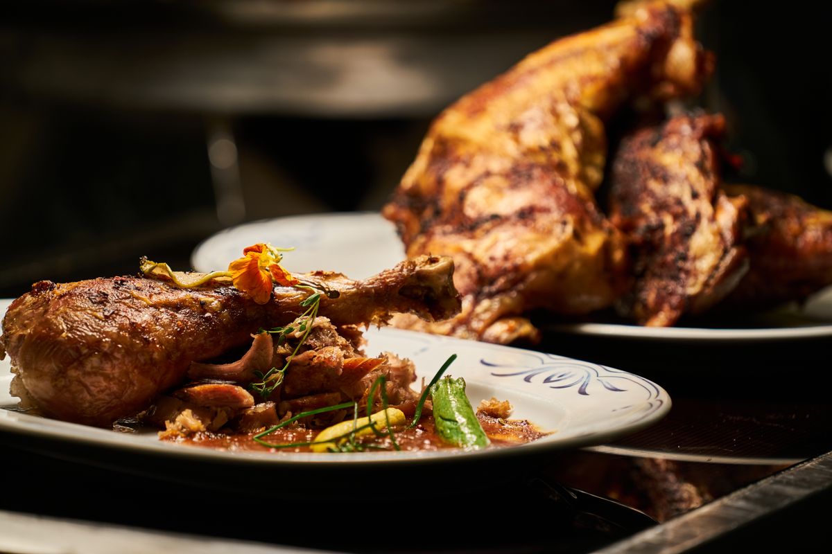 Cooked Cantonese-style chicken on a white plate