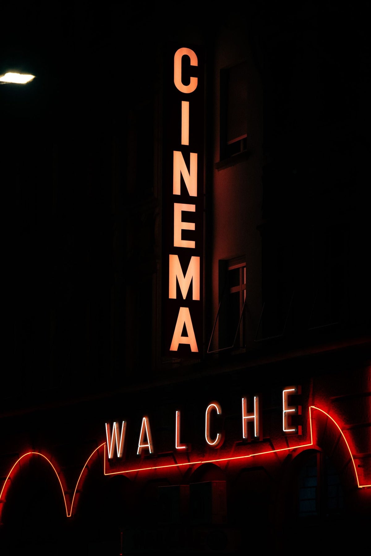 Vintage neon-lit cinema marquee evoking the Hong Kong cinema era Leslie Cheung came to dominate
