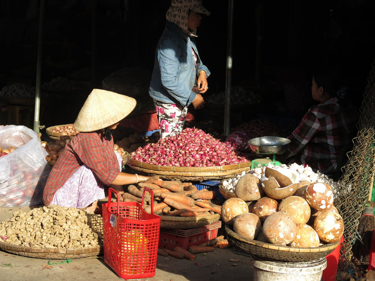 Traditional Asian wet market stall with fresh vegetables on display