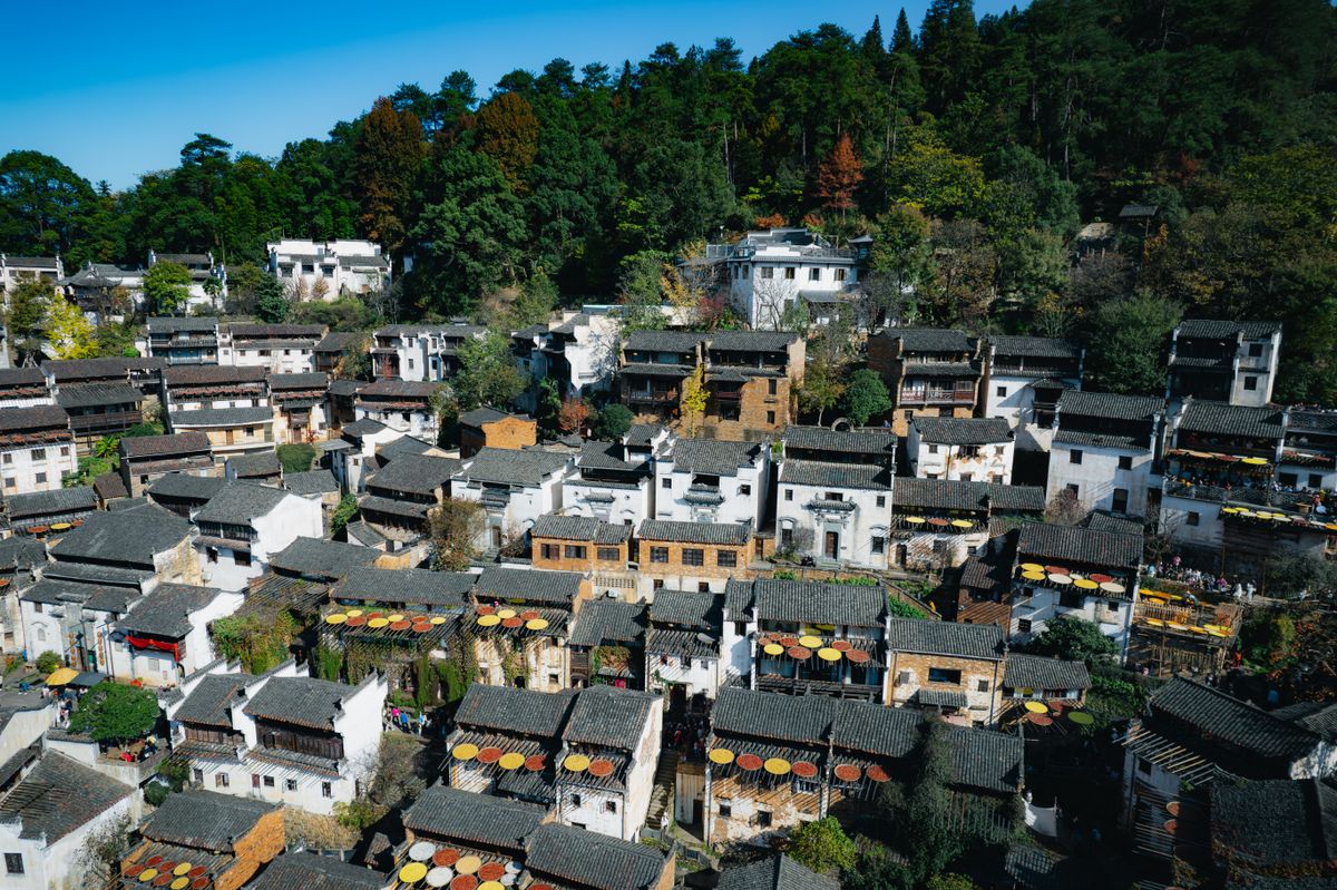 Aerial view of a traditional Chinese village with tiled roofs — the kind of walled village where poon choi was born