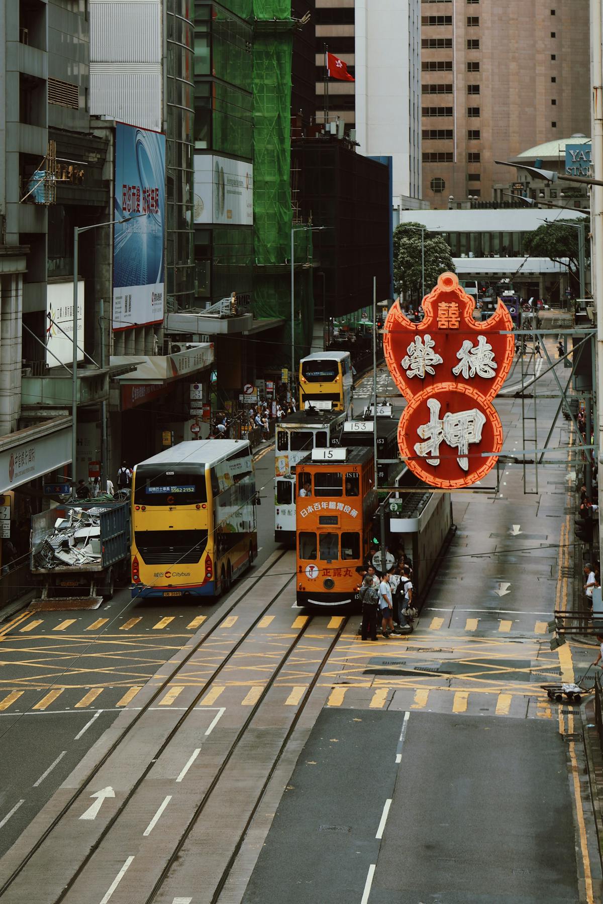 Iconic street scene of Hong Kong with trams and neon signs