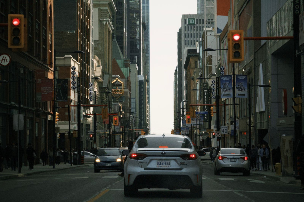 Downtown Toronto street scene with traffic, urban buildings and streetcars