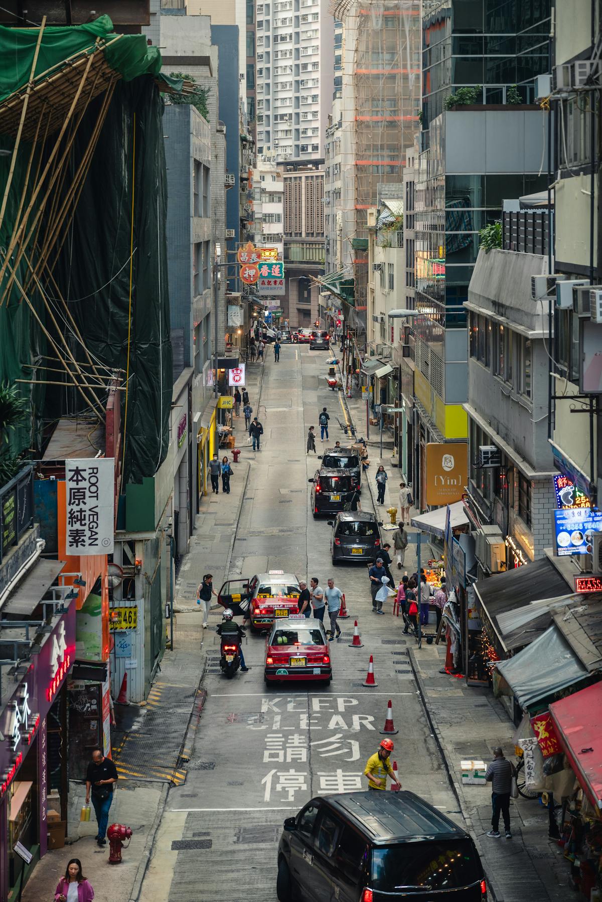 Bustling street scene in Central Hong Kong representing the Cantonese diaspora roots