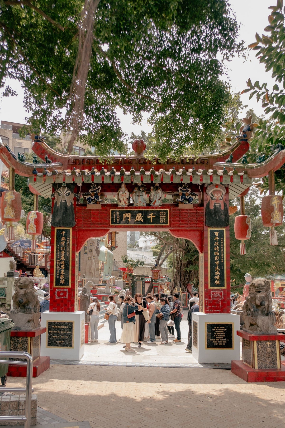 Visitors gather at the colourful entrance of Wong Tai Sin Temple in Hong Kong — Kowloon's busiest religious address