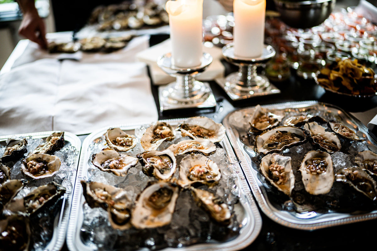 A tray of fresh oysters on a table — the raw material that started Cantonese cuisine's most exported condiment