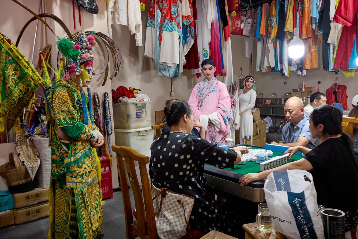 Backstage glimpse into traditional Chinese opera with performers in costume