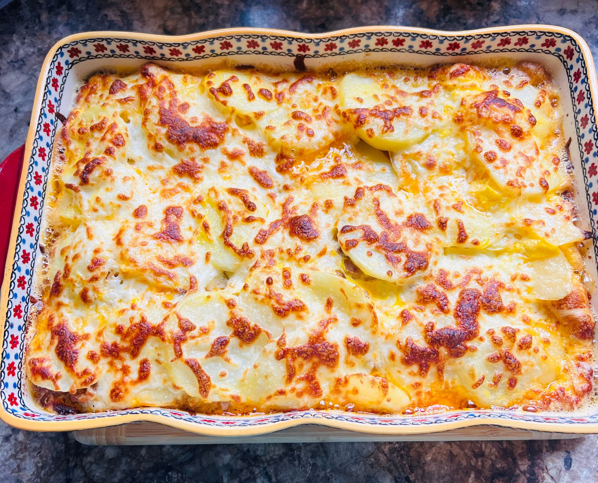 Golden baked cheese casserole with a bubbling crust fresh from the oven