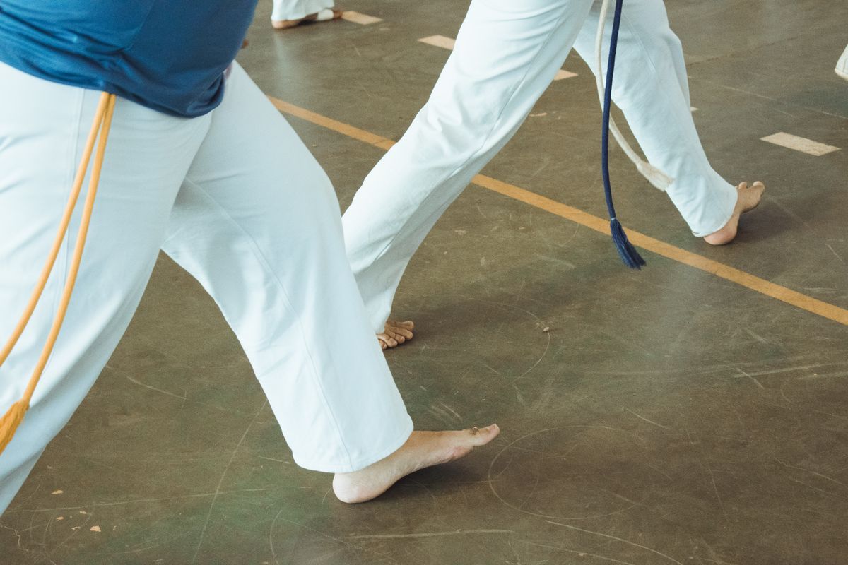 A martial artist mid-strike during training