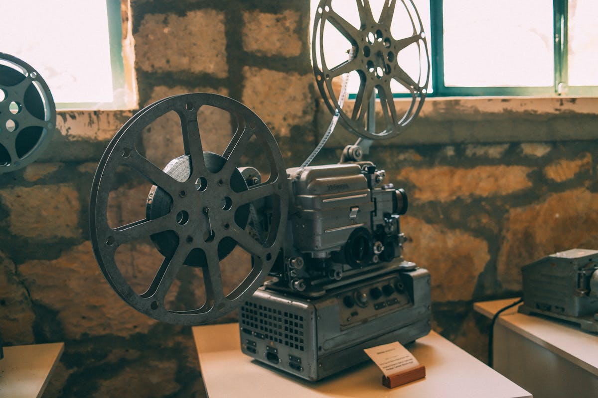 Vintage film projector in a rustic setting, evoking the golden age of Hong Kong cinema