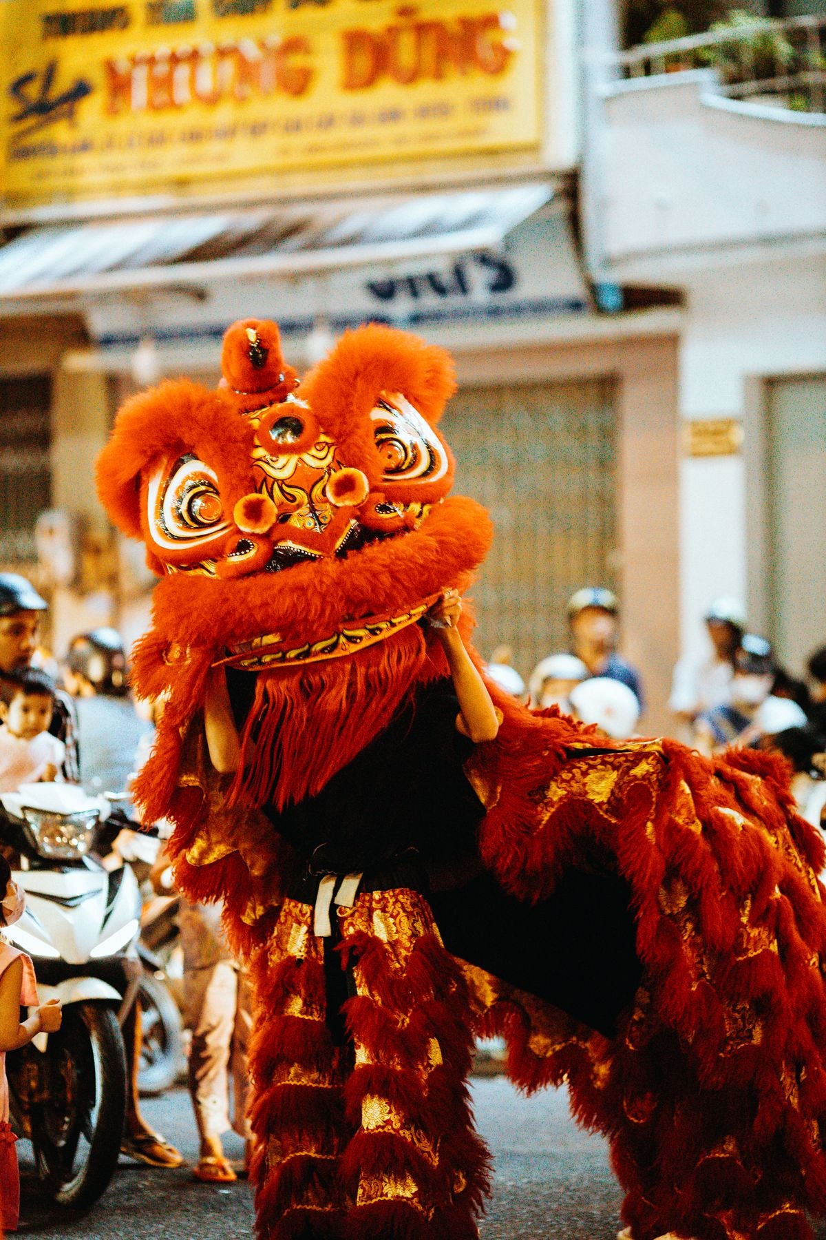 Vibrant Chinese Southern Lion dance performance on the street