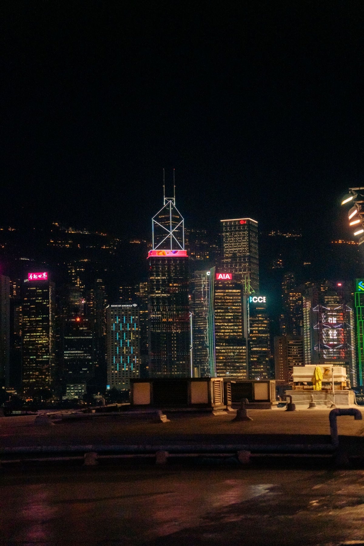 Hong Kong harbour skyline at night illuminated