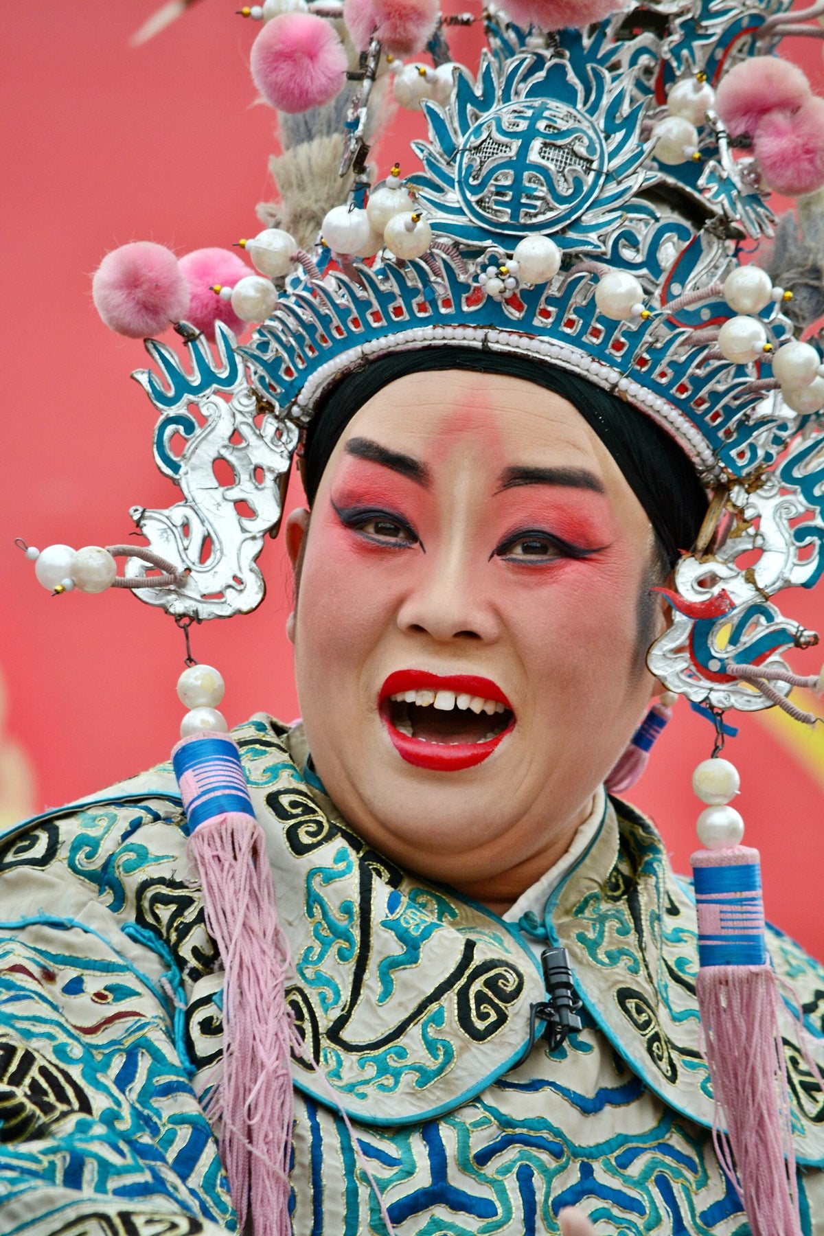 Traditional Chinese opera performer in elaborate stage costume and makeup