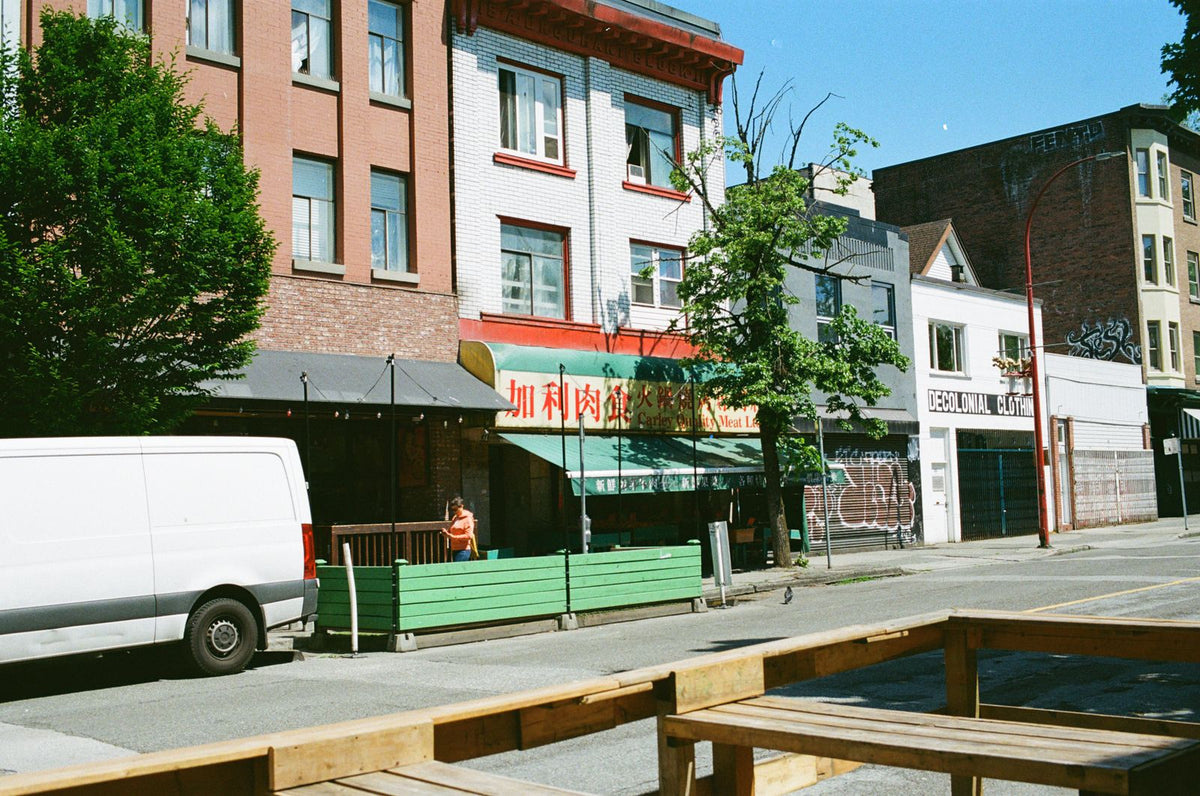 Vibrant Vancouver Chinatown street view with colorful buildings and daily life
