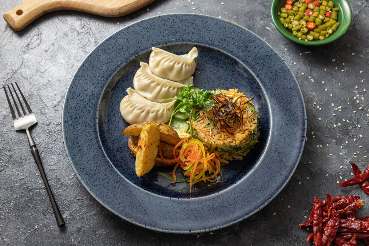 Overhead view of a Cantonese-style plate with dim sum dumplings