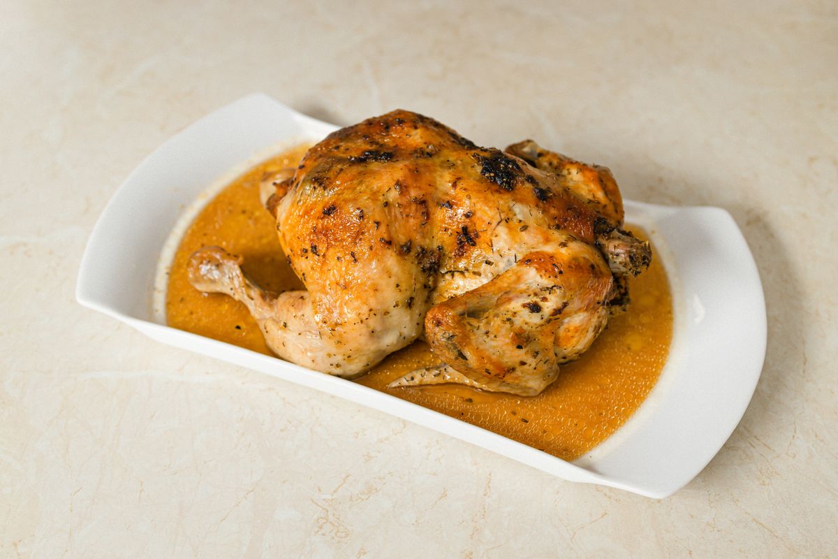 A Cantonese-style whole chicken plated simply