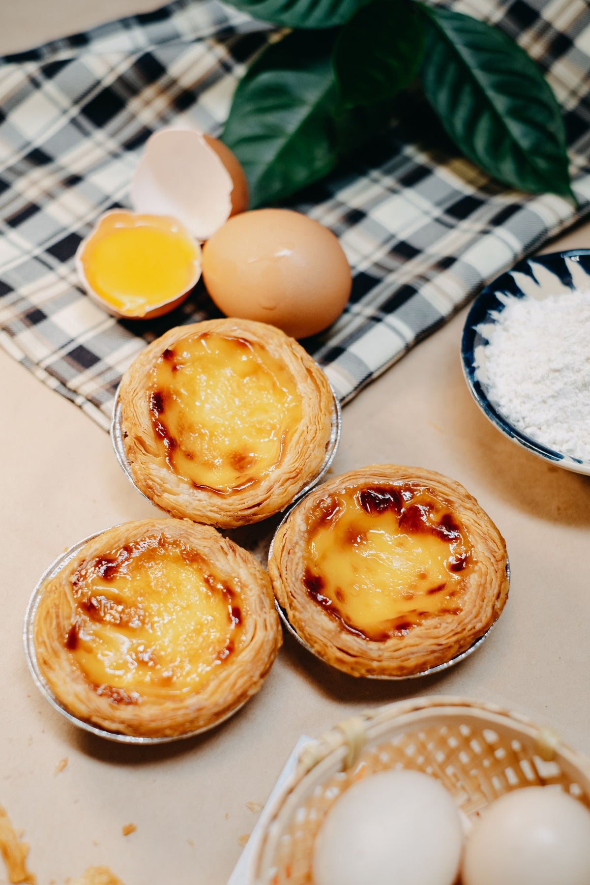 Close-up of golden Hong Kong-style egg tarts on display