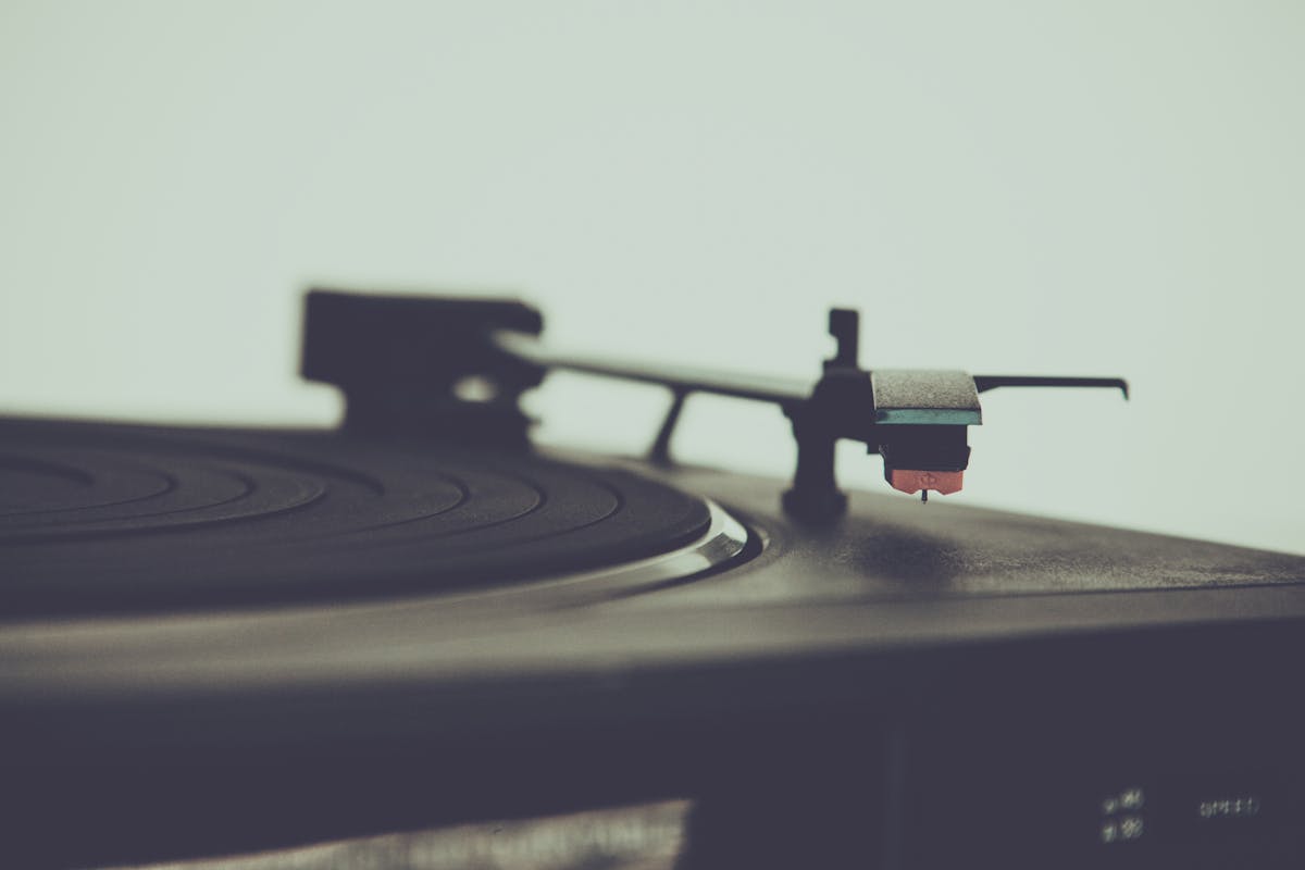 Vintage turntable with vinyl record, capturing retro music nostalgia