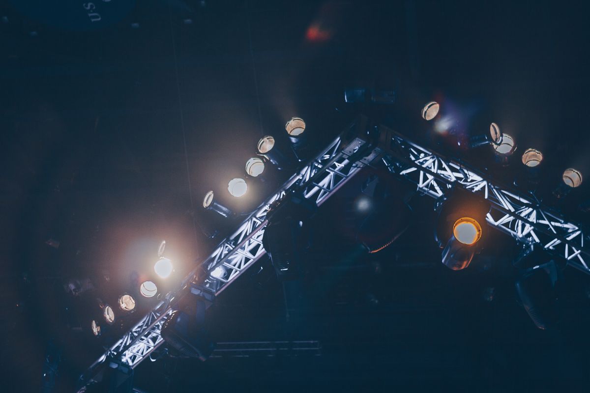 Concert stage lights glowing on a dark stage